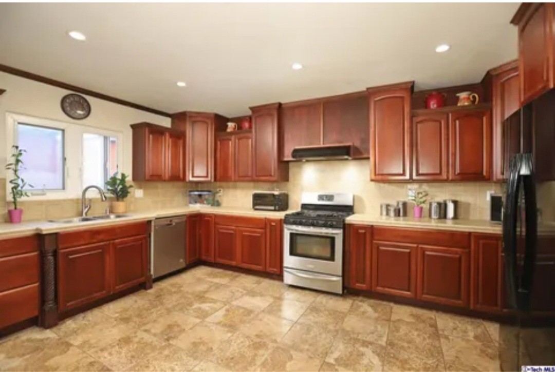 Burbank kitchen with wood cabinets and stone counters