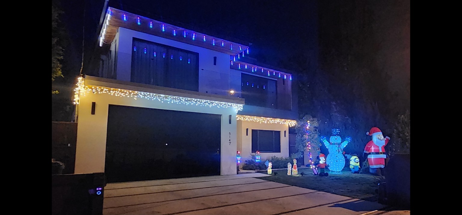 Hartsook home at night with festive holiday lighting