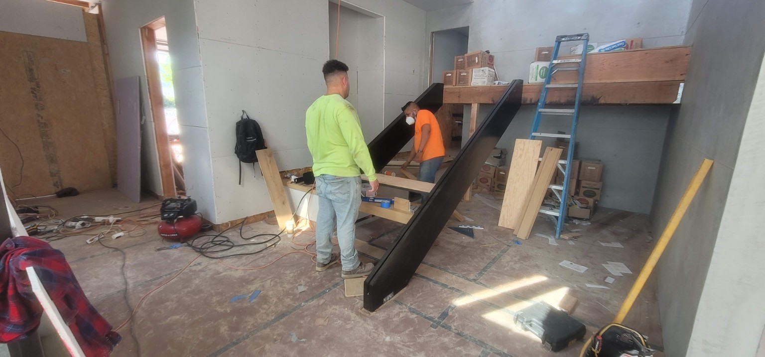 Crew installing the staircase during construction at Hartsook